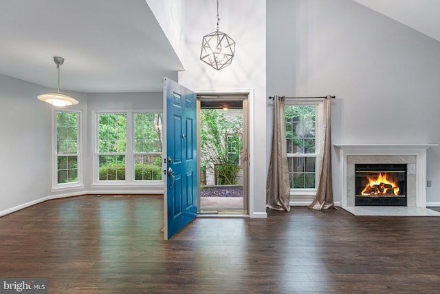 1651 Hugo Cir, Silver Spring, MD 20906 - unfurnished living room with wood finished floors, healthy amount of natural light, a high end fireplace, a high ceiling, and a chandelier