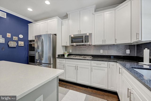 2596 Twin Birch Rd, Hanover, MD 21076 - kitchen featuring stainless steel appliances, white cabinetry, backsplash, recessed lighting, and crown molding