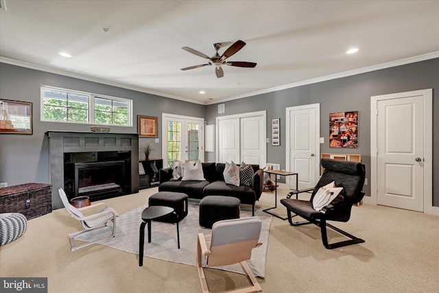 2596 Twin Birch Rd, Hanover, MD 21076 - living room featuring a fireplace, light colored carpet, ceiling fan, recessed lighting, and ornamental molding
