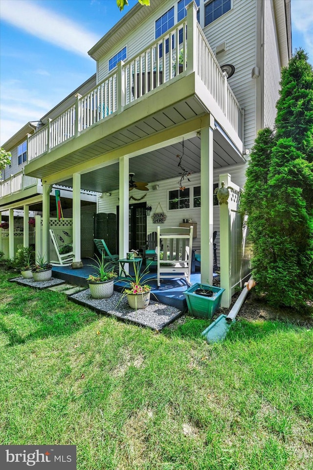 2596 Twin Birch Rd, Hanover, MD 21076 - rear view of property featuring a balcony, a ceiling fan, and a lawn