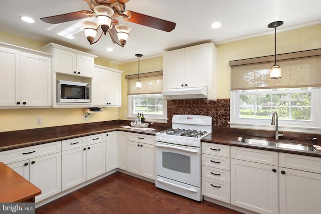 9 Morningside Dr, Pennington, NJ 08534 - kitchen with white appliances, under cabinet range hood, dark countertops, healthy amount of natural light, and recessed lighting