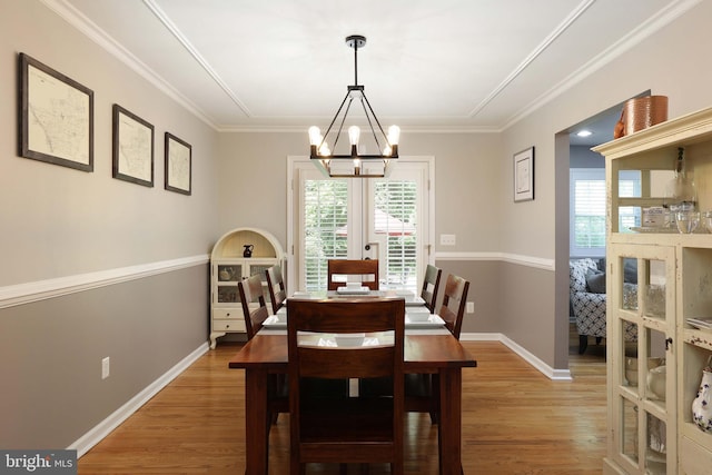 9 Morningside Dr, Pennington, NJ 08534 - dining room with healthy amount of natural light, light wood-style flooring, a chandelier, and crown molding