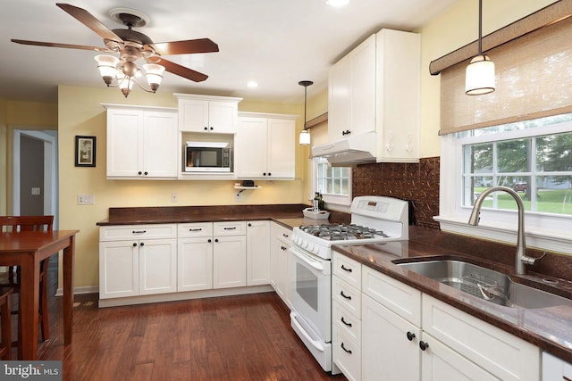 9 Morningside Dr, Pennington, NJ 08534 - kitchen with white range with gas stovetop, under cabinet range hood, a ceiling fan, white cabinets, and dark wood-type flooring