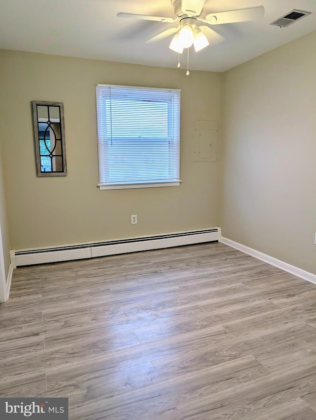 532 Sunrise Ave, Harbour View, Somers Point, NJ 08244 - spare room with baseboard heating, ceiling fan, and wood finished floors