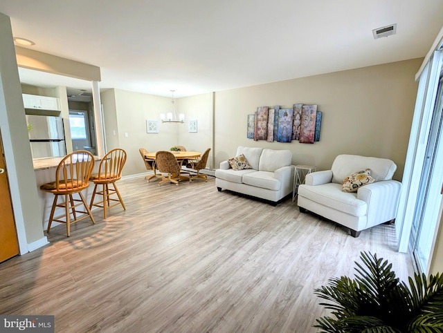 532 Sunrise Ave, Harbour View, Somers Point, NJ 08244 - living area featuring light wood finished floors and a chandelier