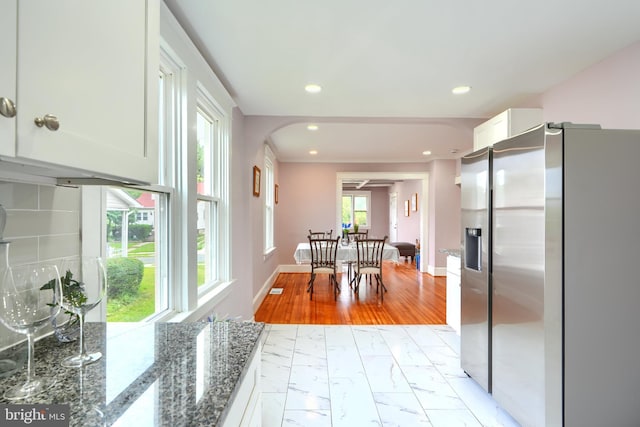2721 Louise Ave, Baltimore, MD 21214 - dining space with light marble finish floors, recessed lighting, and arched walkways