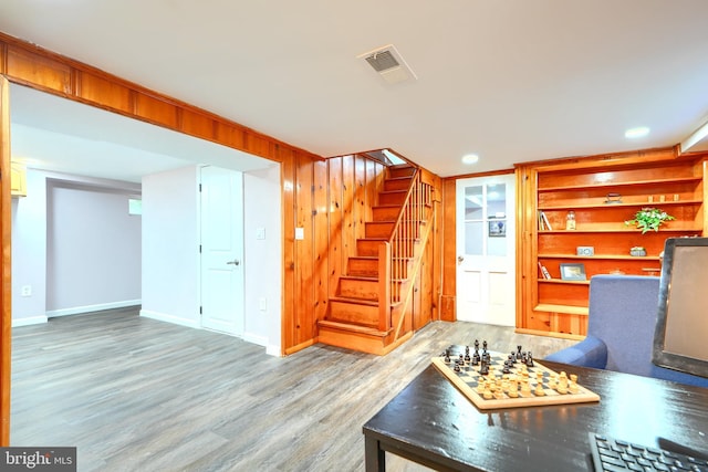 2721 Louise Ave, Baltimore, MD 21214 - living area with wood finished floors, stairway, and built in features