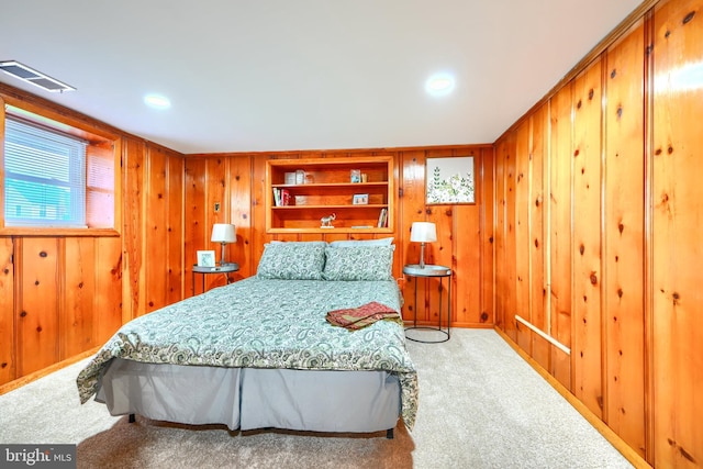 2721 Louise Ave, Baltimore, MD 21214 - bedroom with wood walls and carpet flooring