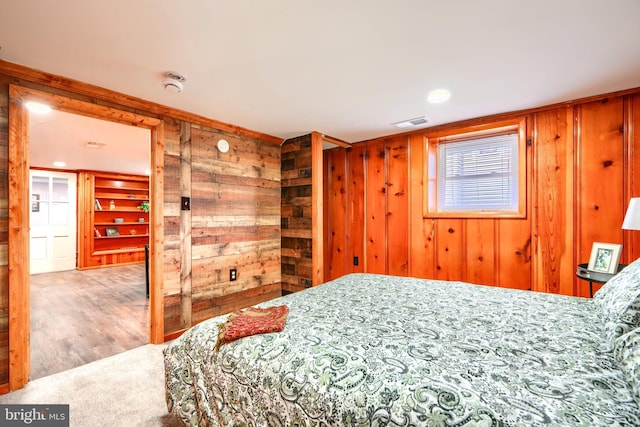 2721 Louise Ave, Baltimore, MD 21214 - bedroom featuring wood walls and wood finished floors