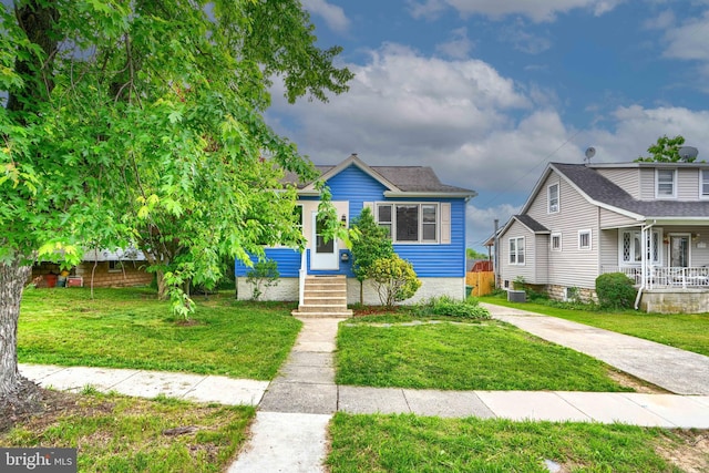 2721 Louise Ave, Baltimore, MD 21214 - bungalow featuring a porch and a front lawn