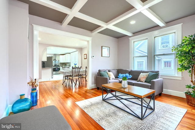 2721 Louise Ave, Baltimore, MD 21214 - living area with coffered ceiling, light wood finished floors, arched walkways, and beamed ceiling