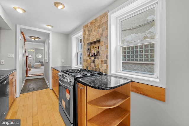 307 S Exeter St, Baltimore, MD 21202 - kitchen with stainless steel range with gas stovetop, dishwasher, open shelves, light wood-type flooring, and dark stone counters