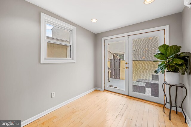 307 S Exeter St, Baltimore, MD 21202 - doorway to outside with french doors, wood finished floors, and recessed lighting