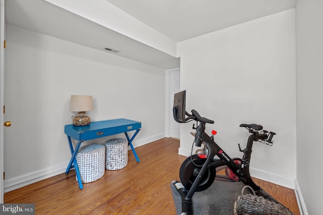 307 S Exeter St, Baltimore, MD 21202 - exercise area with wood finished floors and baseboards