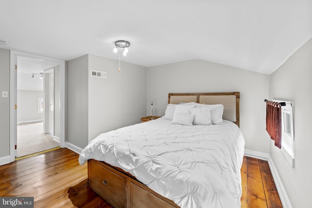 307 S Exeter St, Baltimore, MD 21202 - bedroom with hardwood / wood-style flooring and lofted ceiling