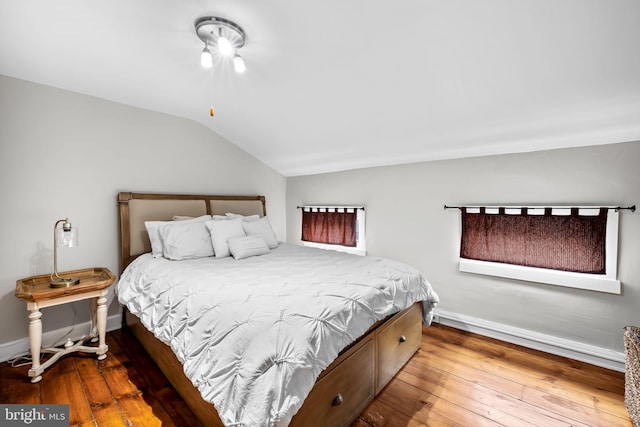 307 S Exeter St, Baltimore, MD 21202 - bedroom with lofted ceiling and hardwood / wood-style floors