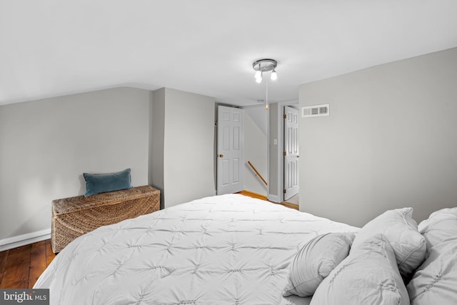 307 S Exeter St, Baltimore, MD 21202 - bedroom featuring wood finished floors and baseboards
