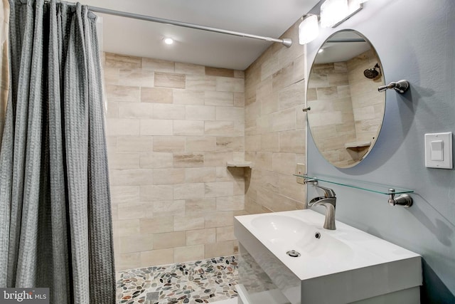 307 S Exeter St, Baltimore, MD 21202 - full bath featuring a tile shower and vanity