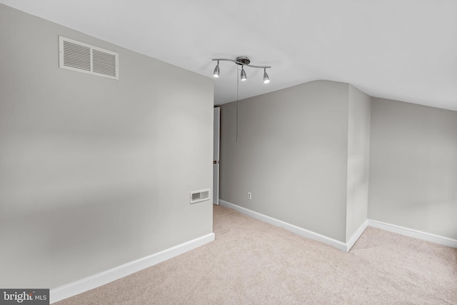 307 S Exeter St, Baltimore, MD 21202 - additional living space with carpet floors and vaulted ceiling