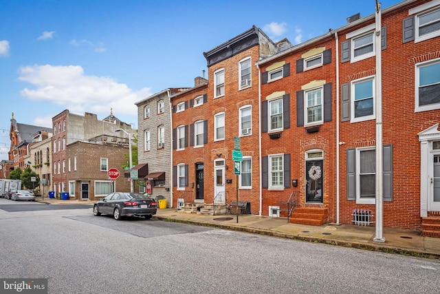 307 S Exeter St, Baltimore, MD 21202 - view of property with entry steps and a residential view