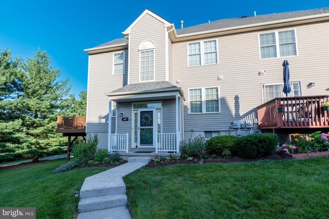 619 Hamilton St, Collegeville, PA 19426 - view of front of home featuring a front lawn, a wooden deck, and a shingled roof