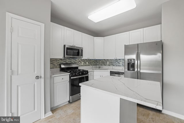 21024 Mossy Glen Ter, Ashburn, VA 20147 - kitchen featuring appliances with stainless steel finishes, white cabinets, and decorative backsplash