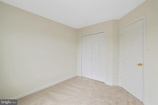 21024 Mossy Glen Ter, Ashburn, VA 20147 - unfurnished bedroom featuring carpet and a closet