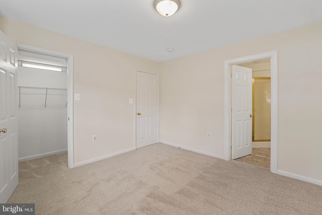 21024 Mossy Glen Ter, Ashburn, VA 20147 - unfurnished bedroom with carpet flooring, a walk in closet, and a closet