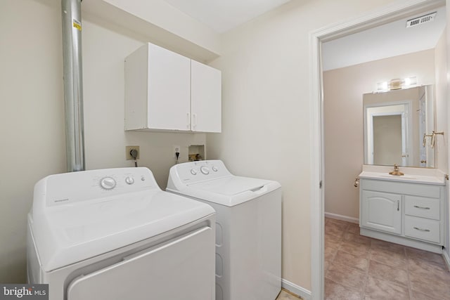 21024 Mossy Glen Ter, Ashburn, VA 20147 - laundry area with washer and dryer and cabinet space