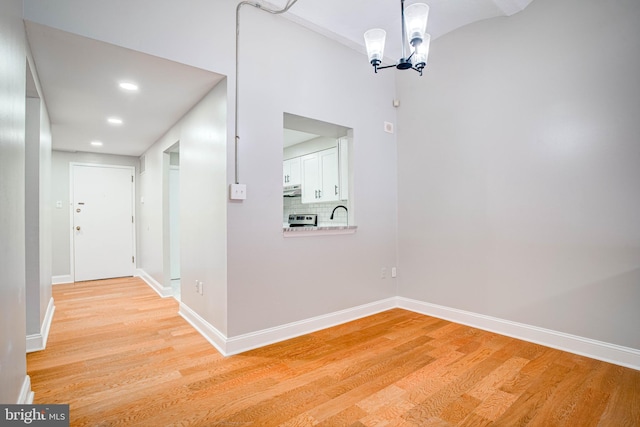 825 N 29th St Unit 1B, Philadelphia, PA 19130 - hall with light wood finished floors, a chandelier, and recessed lighting