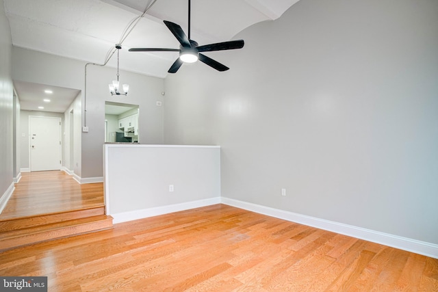 825 N 29th St Unit 1B, Philadelphia, PA 19130 - empty room featuring light wood-style flooring, ceiling fan, lofted ceiling, and a chandelier