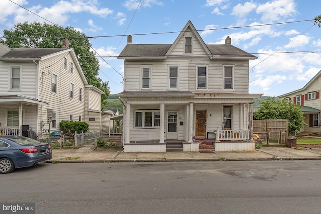324 N 2nd St, Lykens, PA 17048 - multi unit property featuring a gate, a porch, and a chimney