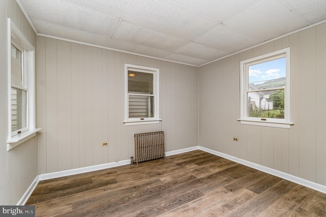 324 N 2nd St, Lykens, PA 17048 - spare room featuring radiator heating unit and dark wood-style floors