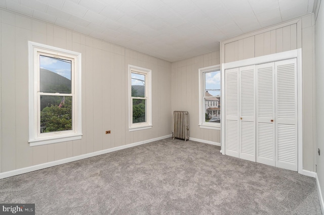 324 N 2nd St, Lykens, PA 17048 - unfurnished bedroom featuring carpet floors, radiator heating unit, and a closet