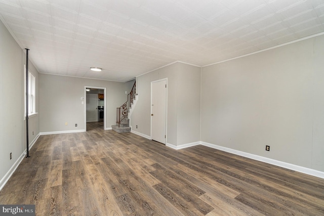 324 N 2nd St, Lykens, PA 17048 - empty room with stairs, dark wood finished floors, and crown molding