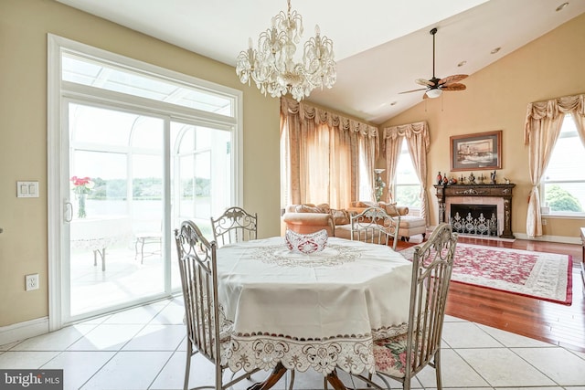 8 Cove Ct, Hainesport, NJ 08036 - dining room featuring lofted ceiling, ceiling fan, light tile patterned floors, a chandelier, and a water view