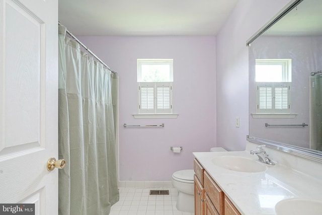 8 Cove Ct, Hainesport, NJ 08036 - full bath featuring tile patterned flooring, double vanity, plenty of natural light, and a shower with shower curtain