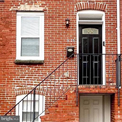 816 Carroll St, Baltimore, MD 21230 - entrance to property with brick siding