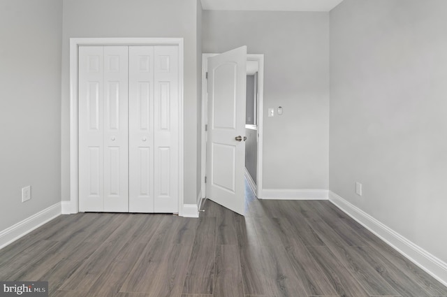 816 Carroll St, Baltimore, MD 21230 - unfurnished bedroom with a closet and dark wood finished floors