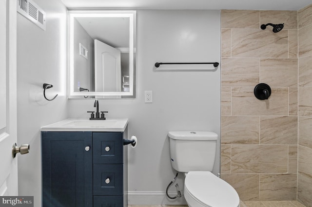 816 Carroll St, Baltimore, MD 21230 - bathroom featuring vanity and tiled shower