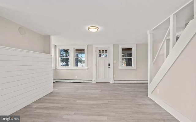 1832 E Buckshutem Rd, Millville, NJ 08332 - entrance foyer featuring a baseboard radiator, a baseboard heating unit, wood finished floors, and stairs