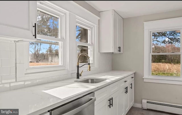 1832 E Buckshutem Rd, Millville, NJ 08332 - kitchen featuring baseboard heating, stainless steel dishwasher, white cabinetry, and light stone countertops