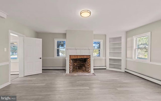 1832 E Buckshutem Rd, Millville, NJ 08332 - unfurnished living room with a baseboard radiator, wood finished floors, and a fireplace