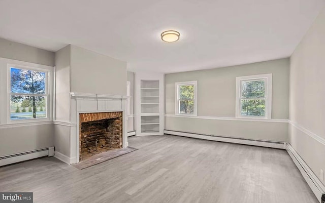 1832 E Buckshutem Rd, Millville, NJ 08332 - unfurnished living room featuring a baseboard heating unit, wood finished floors, a fireplace with flush hearth, and a baseboard radiator