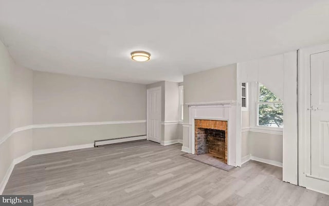 1832 E Buckshutem Rd, Millville, NJ 08332 - unfurnished living room with baseboard heating, wood finished floors, and a fireplace with flush hearth