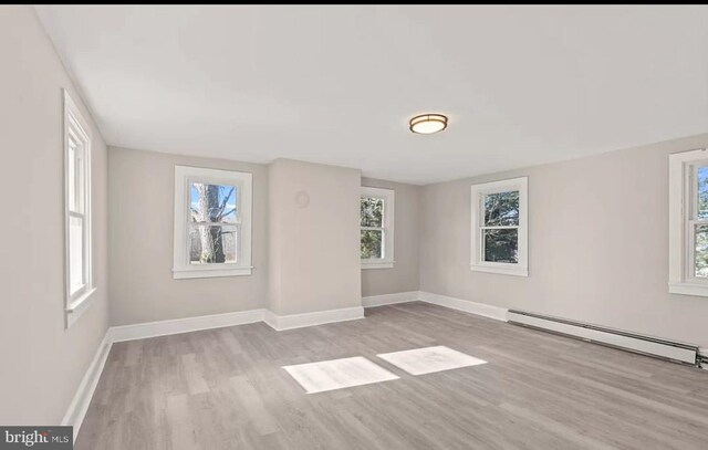 1832 E Buckshutem Rd, Millville, NJ 08332 - spare room featuring baseboard heating and light wood-style flooring