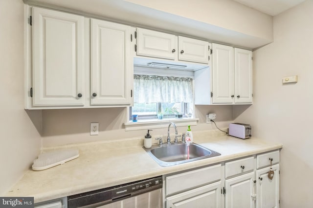 9001 Ridge Ave Unit 31, Philadelphia, PA 19128 - kitchen featuring stainless steel dishwasher, white cabinetry, and light countertops