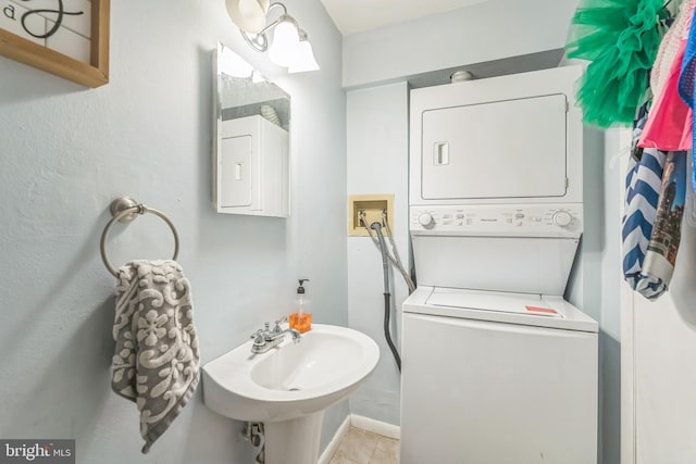 9001 Ridge Ave Unit 31, Philadelphia, PA 19128 - bathroom featuring stacked washer and clothes dryer and a sink