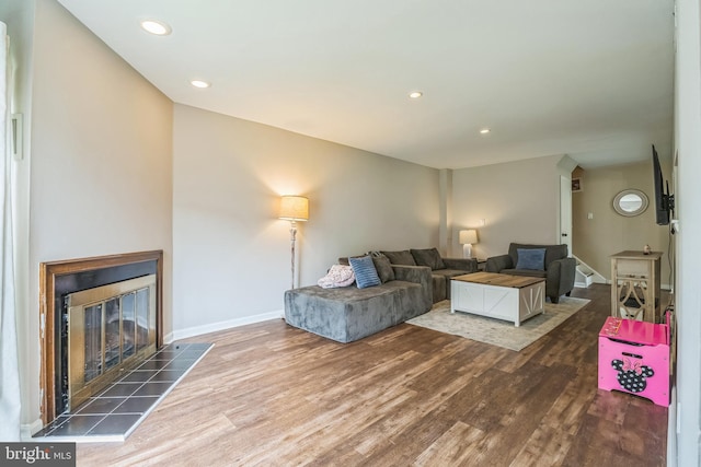 9001 Ridge Ave Unit 31, Philadelphia, PA 19128 - living area featuring wood finished floors, a tile fireplace, and recessed lighting