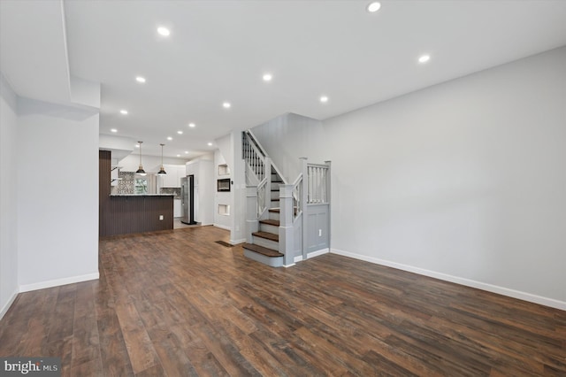 1408 N Redfield St, Philadelphia, PA 19151 - unfurnished living room with dark wood-style flooring, stairway, and recessed lighting